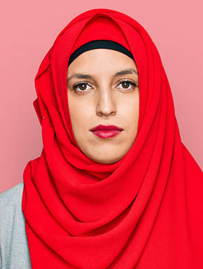 Beautiful hispanic woman wearing traditional islamic hijab scarf with serious expression on face. simple and natural looking at the camera. 