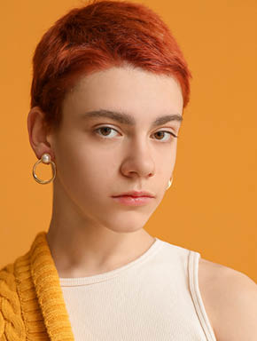 Non-binary teenager on color background